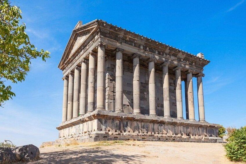 A classical building with columns and a triangular pediment. 3