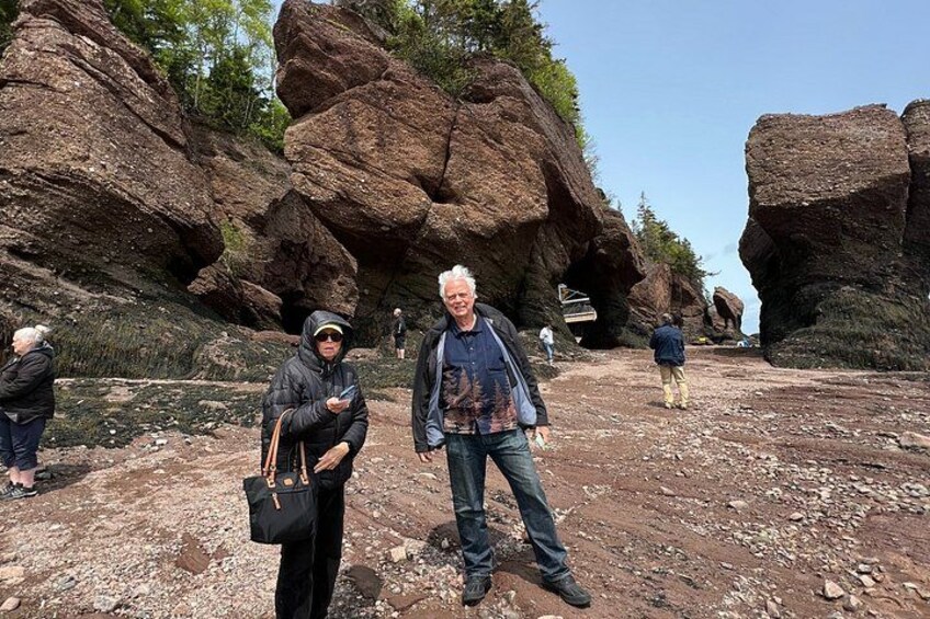 A rocky terrain with large boulders and a clear sky. 3