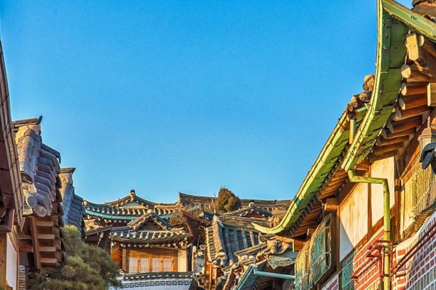 Traditional East Asian architecture with ornate roofs and wooden structures. 3