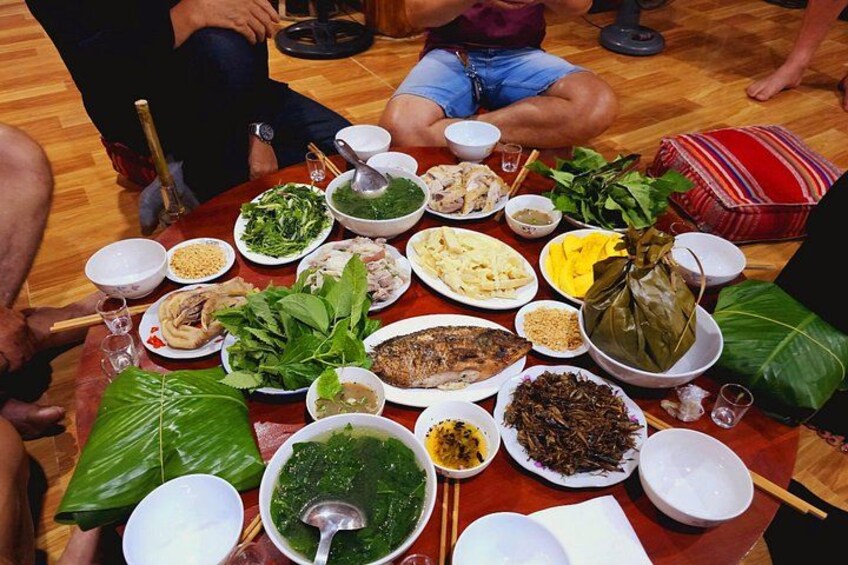 A round table with various dishes and food items, likely for a communal meal. 5