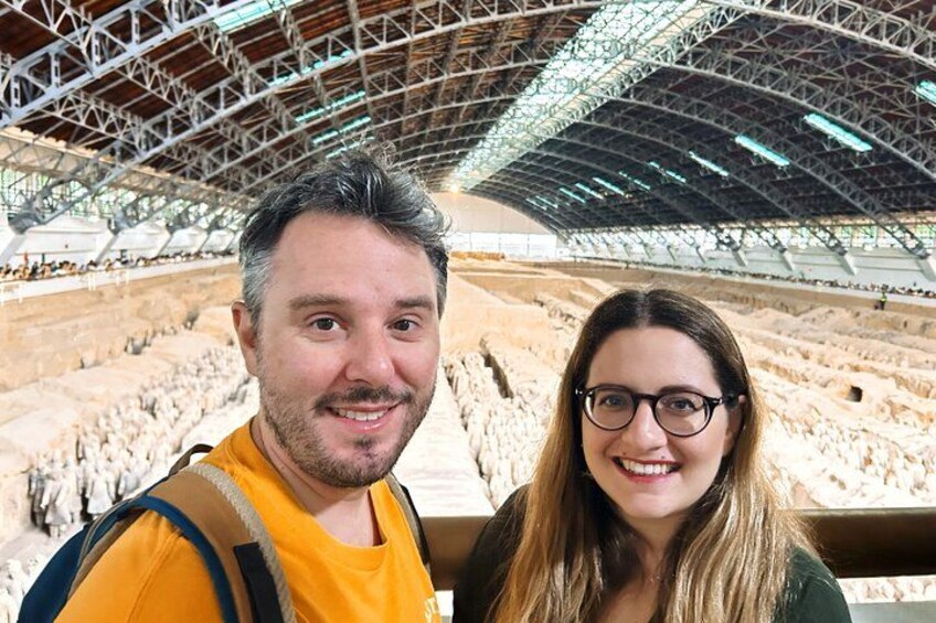 A large indoor stadium with tiered seating and a high ceiling. 4
