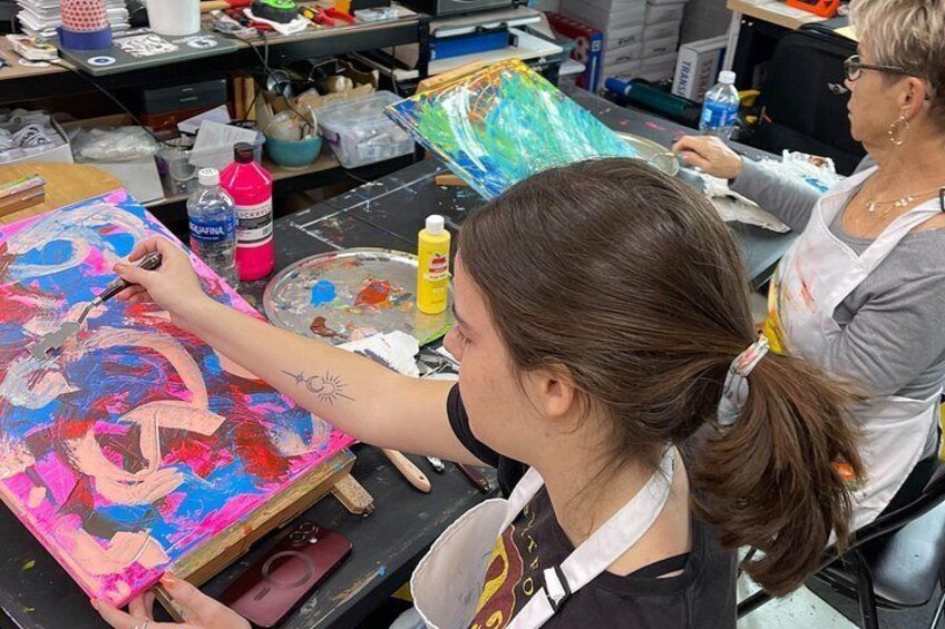 Student participants during the Abstract Painting with Palette Knives course engaging in the abstract art-making process. 2