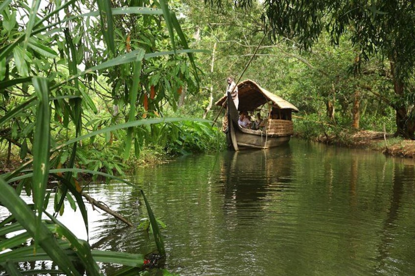 A river with a boat and a person standing on the bank. 5