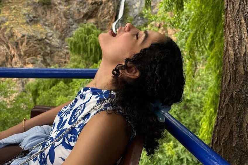 A person reclining against a tree in a natural setting. 1