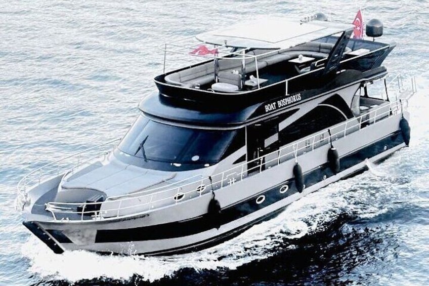 A large, multi-deck boat named 'Boat Despahoros' on water. 1