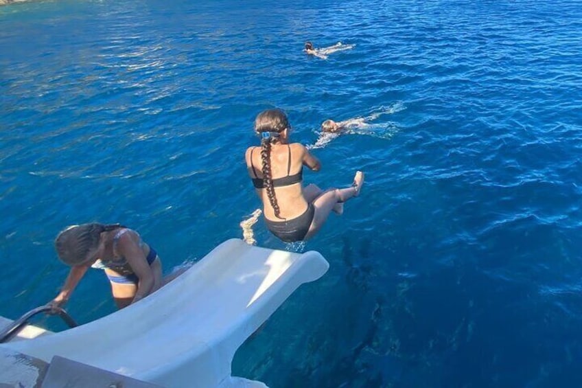 A person diving into the water from a boat. 3