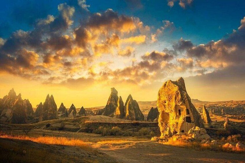 A desert landscape with prominent rock formations and a clear sky. 5