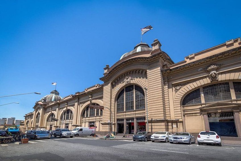 A historic building with large arched windows and a dome. 5