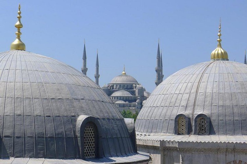 A mosque with large domes and minarets. 3