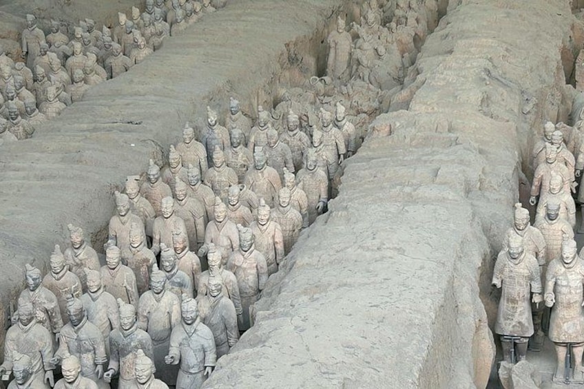 A large number of terracotta soldiers lined up in rows. 3