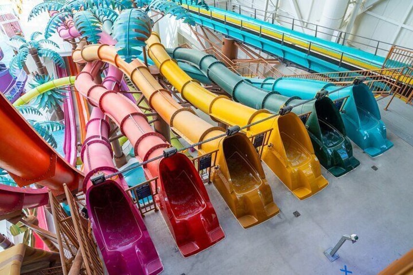 A water park with multiple colorful water slides. 1
