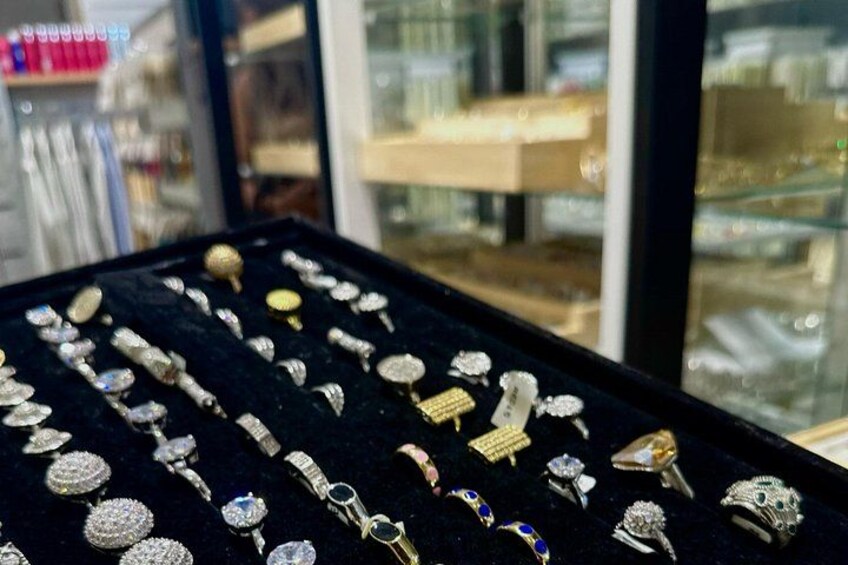 A display of jewelry with various designs and gemstones. 2