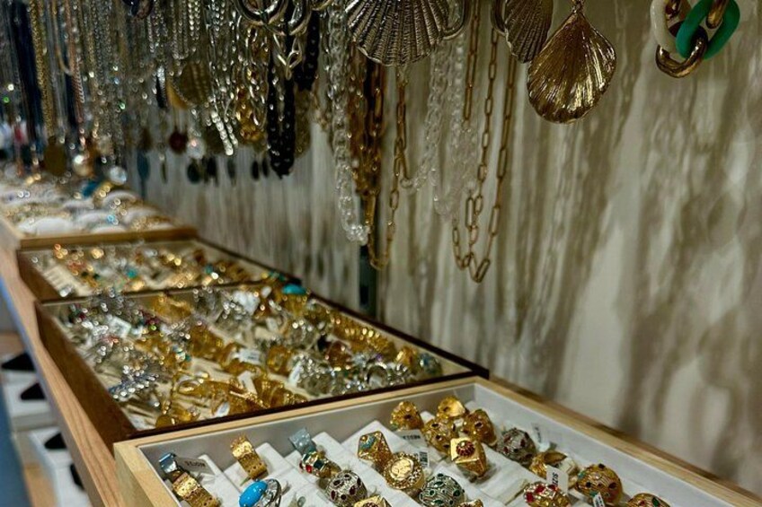A jewelry display with various necklaces and pendants. 5
