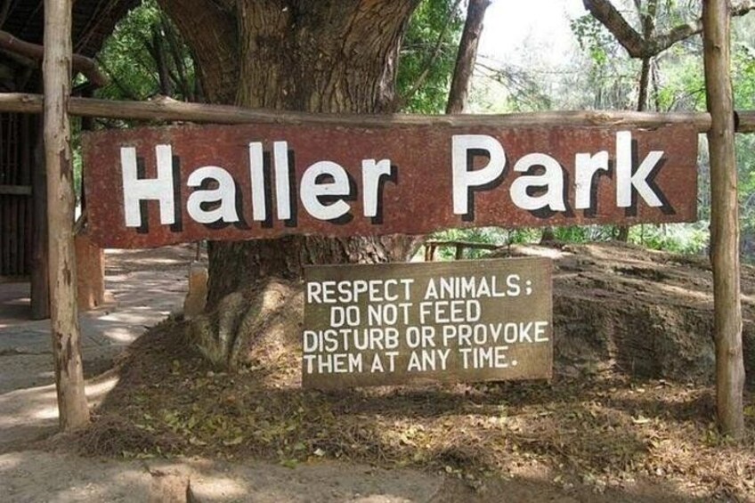 A sign for Haller Park with a warning about respecting animals. 4