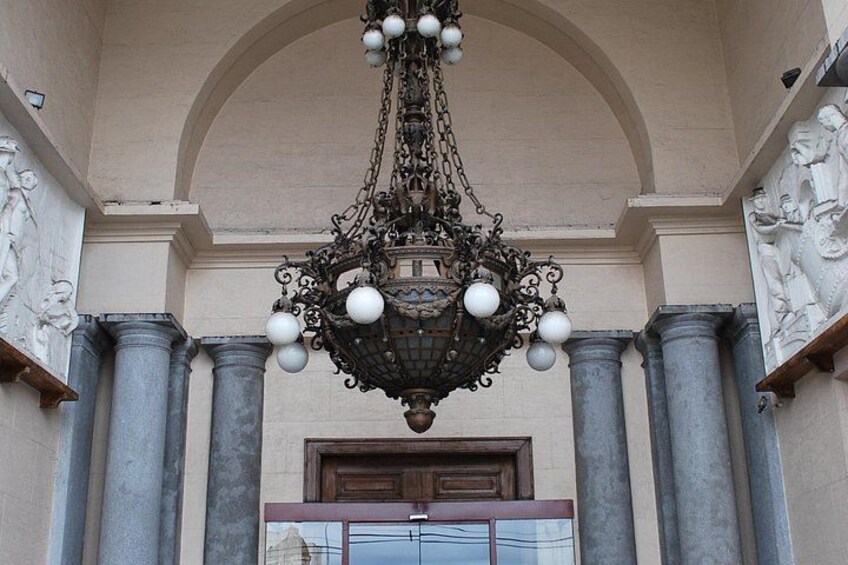 A chandelier, columns, and a door. 4