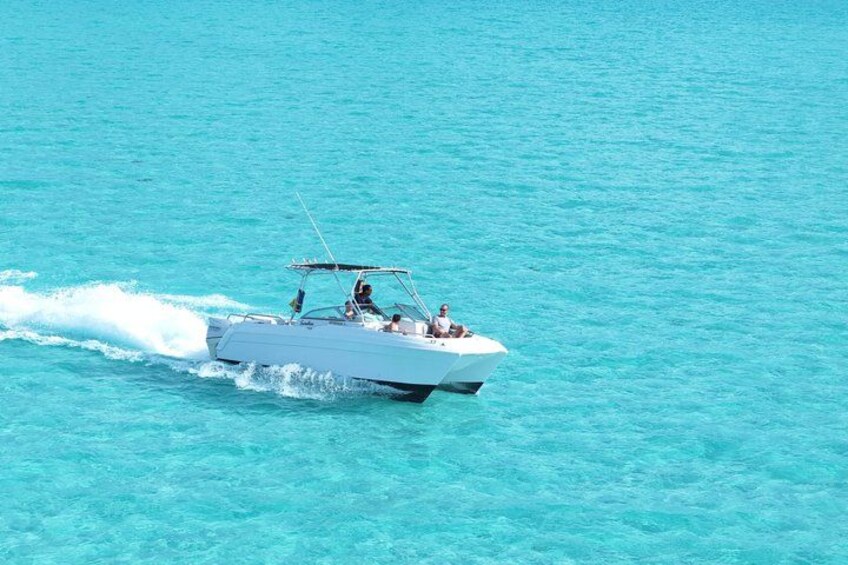 A speedboat on turquoise water. 1