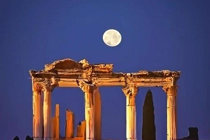 Ancient ruins with columns under a full moon. 2