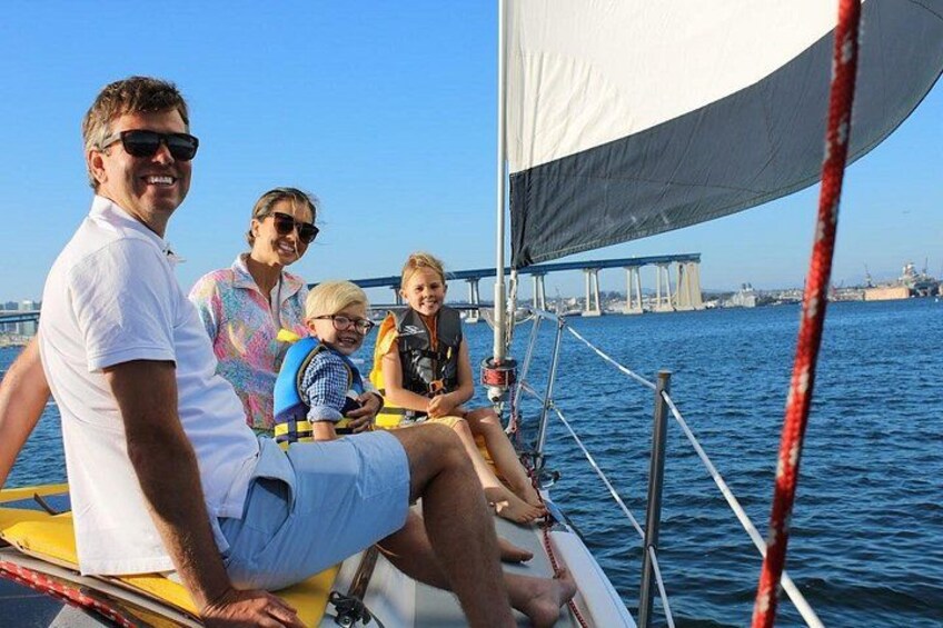 A Family out on the front of the sailboat, enjoying quality time together out on the San Diego Bay 3