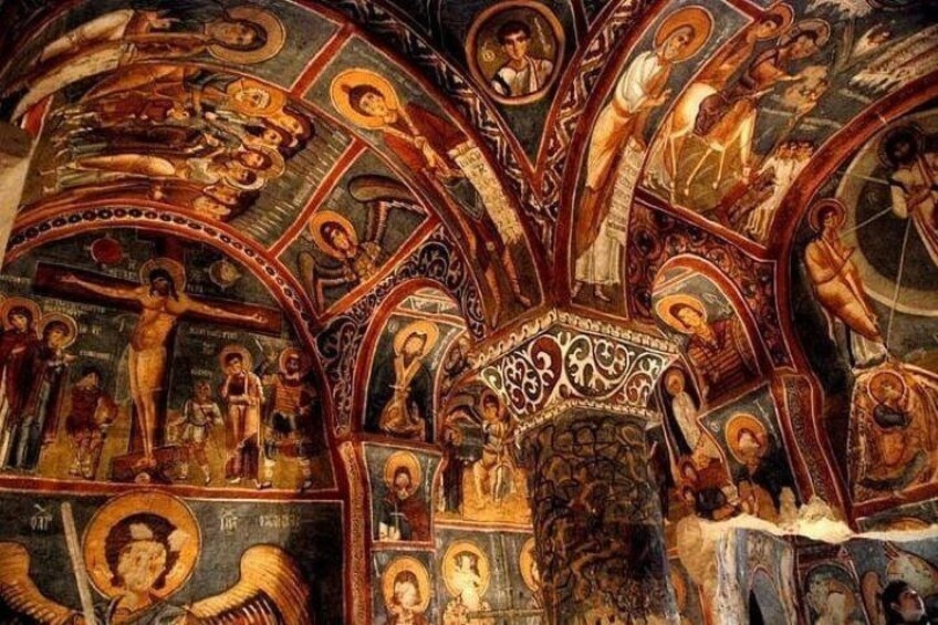 A detailed mosaic with religious figures and architectural elements. 1