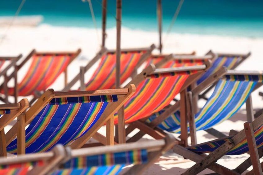 Beach chairs with striped cushions. 4