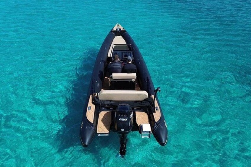 A motorboat on clear turquoise water. 2