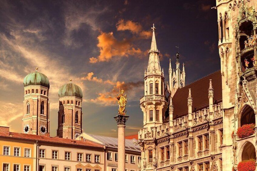 A historic building with ornate architecture, including a tall spire and a clock tower. 4