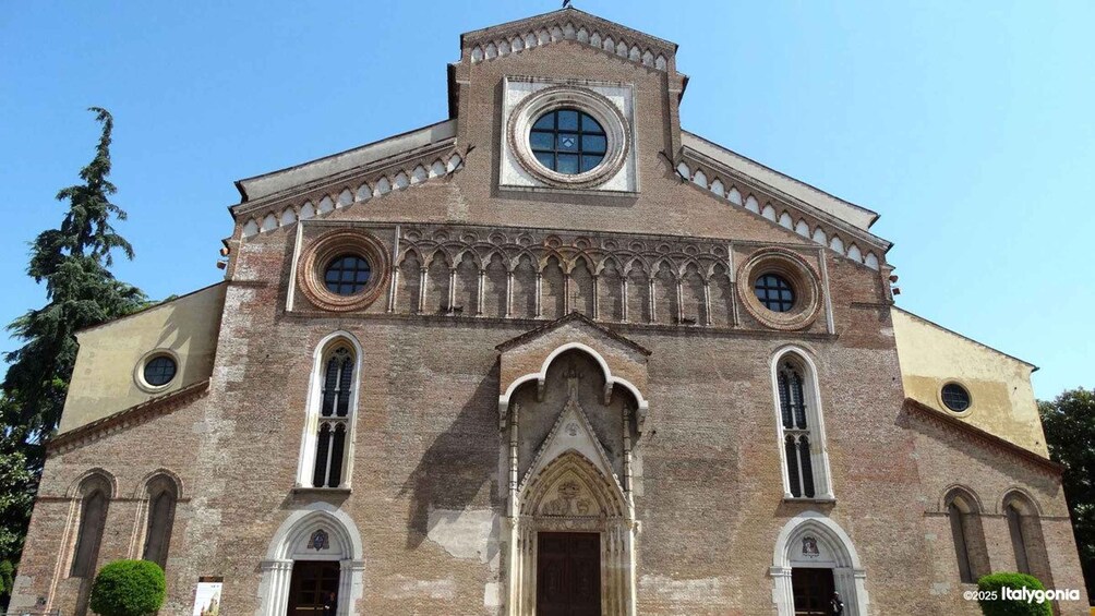 A historic church with a central dome, arched windows, and a bell tower. 3