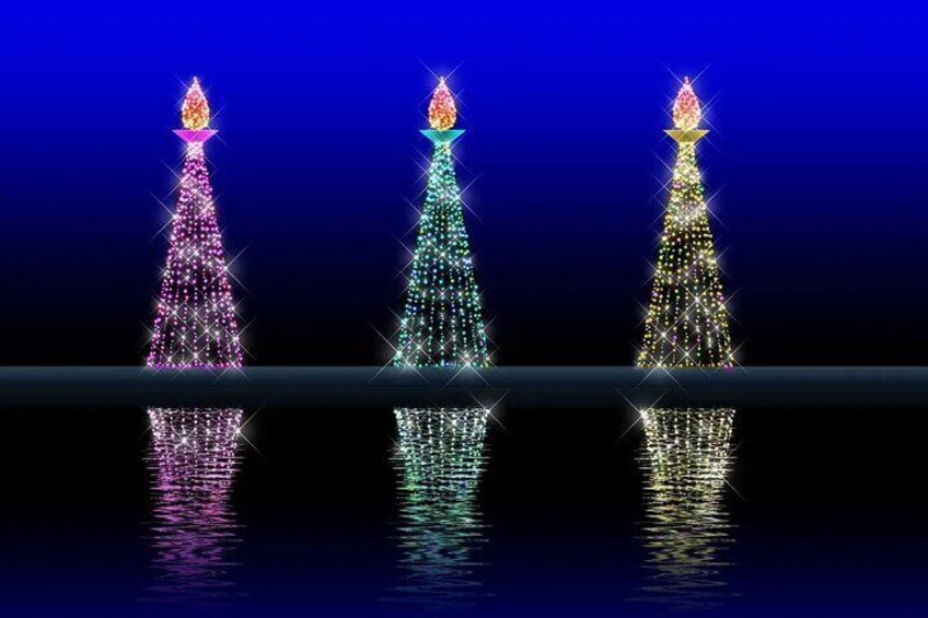 Three illuminated Christmas trees against a dark background. 1
