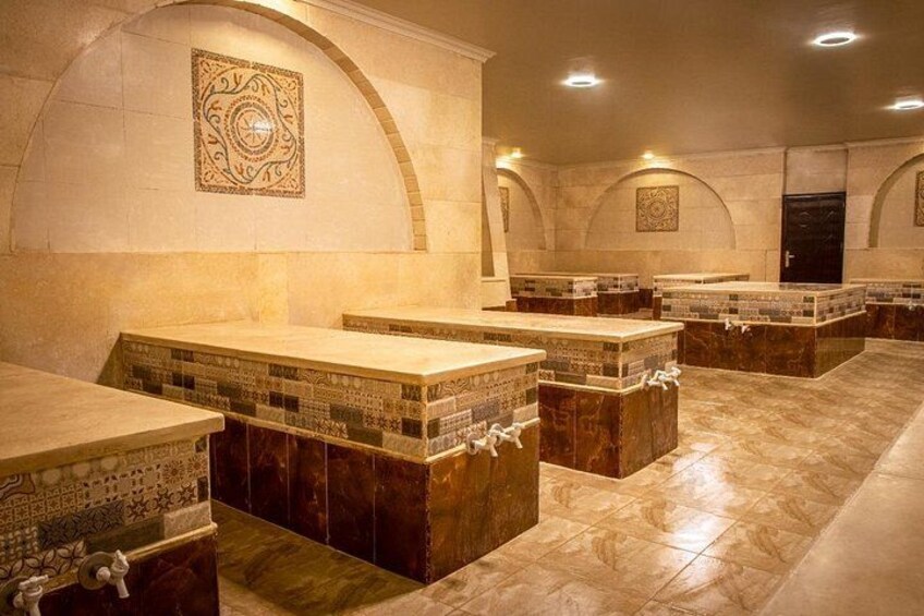A series of tombs with intricate tile work and arched ceilings. 4