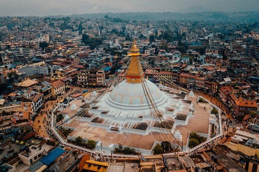 A large, circular temple complex with a central stupa and surrounding buildings. 5