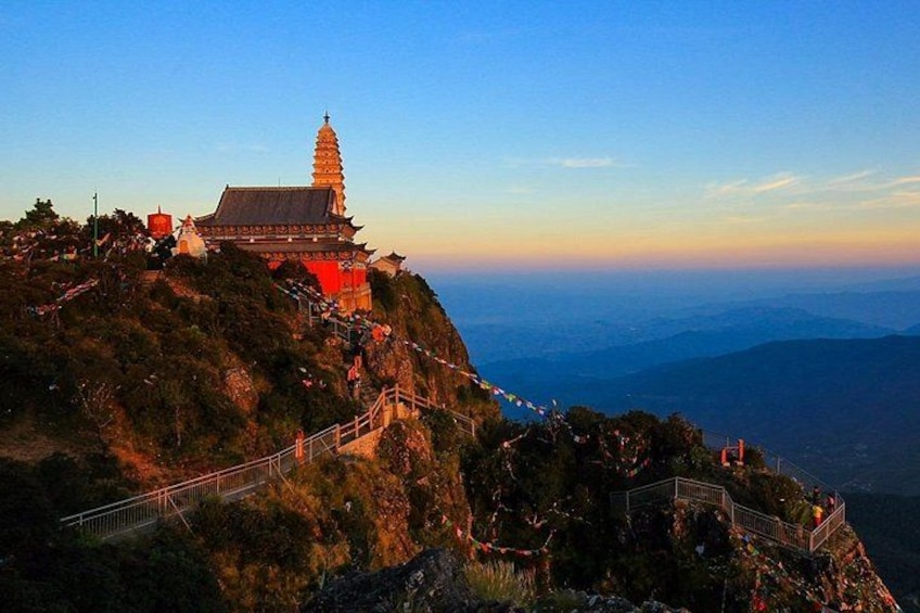 A temple on a mountain with a clear sky. 5
