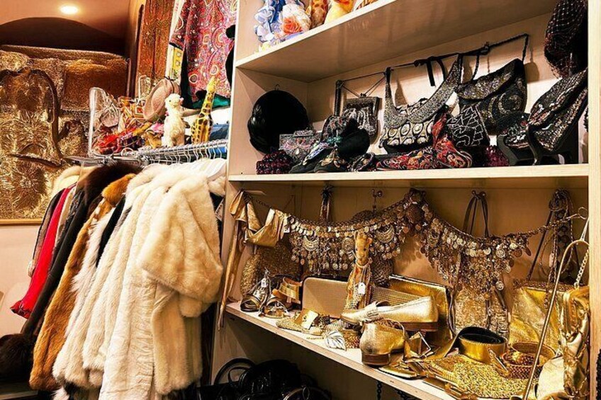A variety of handbags and accessories on shelves and racks. 4