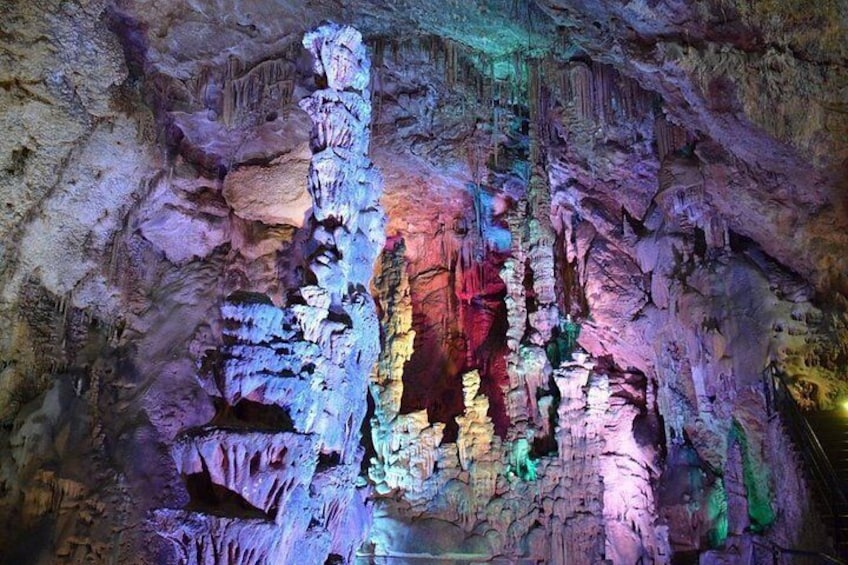 A cave with colorful stalactites and stalagmites. 3