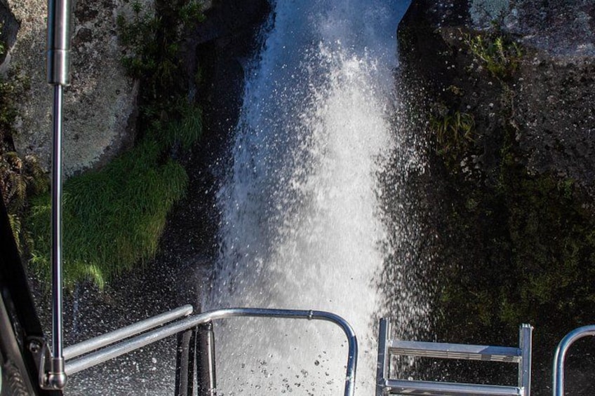 A waterfall cascading down a rocky cliff. 3