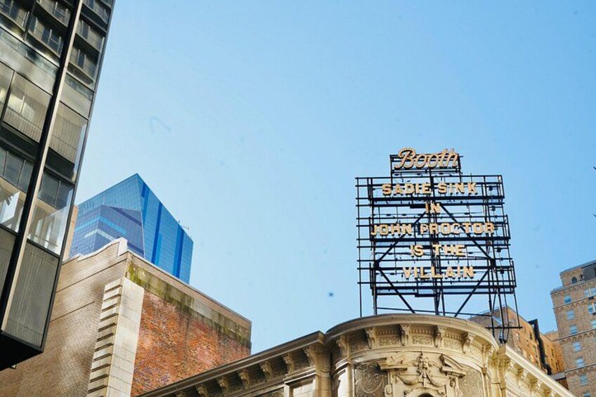 A building with a large, illuminated sign. 4