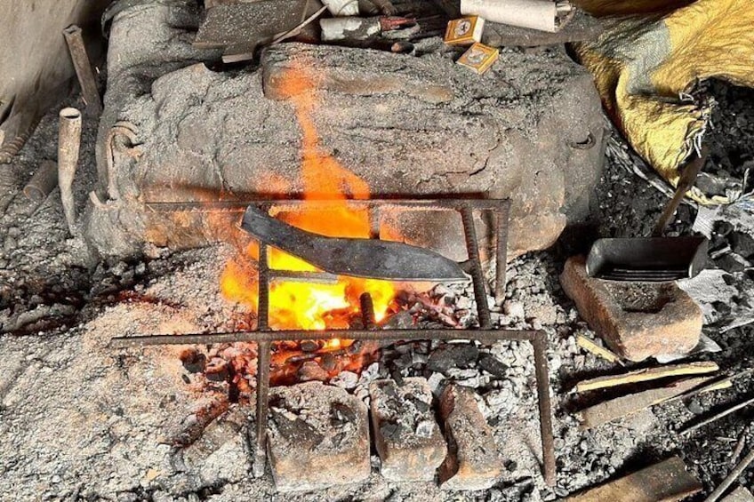 Coil fire burning to metal khukuri knife to take shape 2