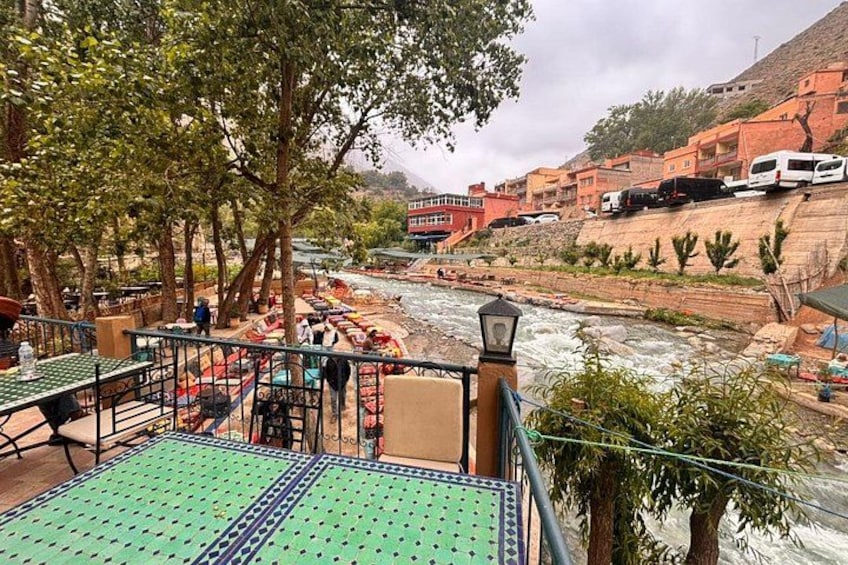 A river with boats, a bridge, and buildings in the background. 4