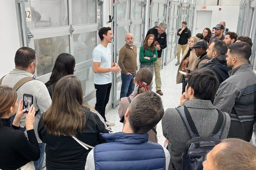 FOUNDER, JOE WEBER EXPLAINS TO GUESTS HOW A CONTROLLED ENVIRONMENT FACILITY IS USED TO GROW MUSHROOMS 1