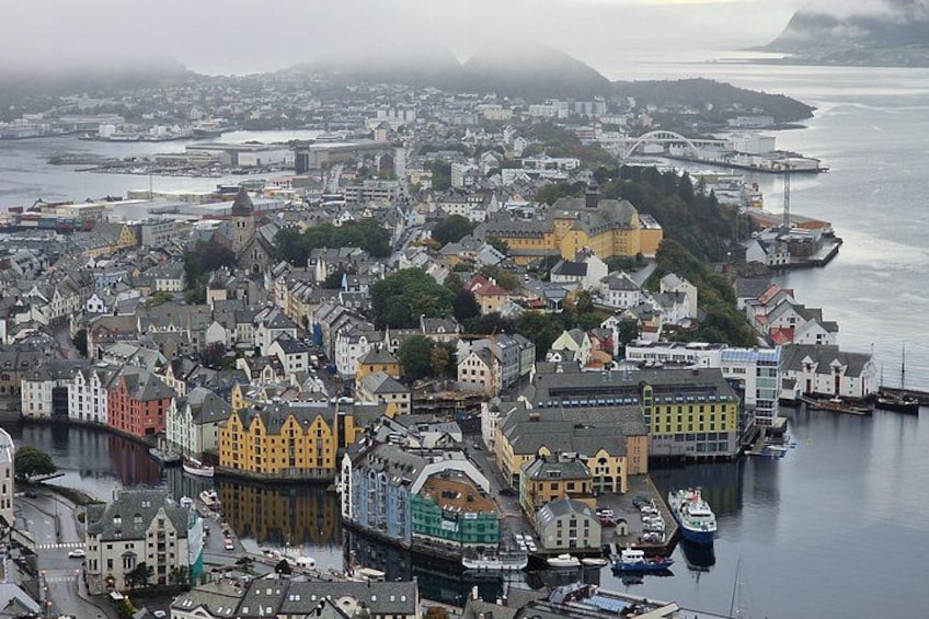 A coastal town with colorful buildings, a harbor, and boats. 4