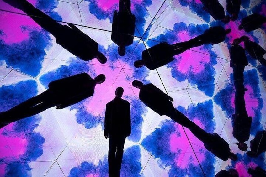 A person standing in the center with multiple silhouettes of people around them. 1