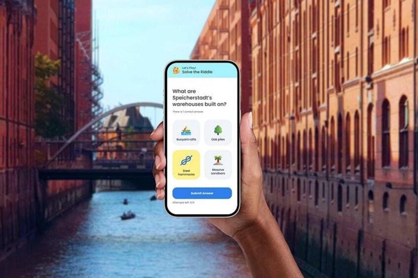 A hand holding a smartphone displaying a riddle about warehouses built on different materials. 1