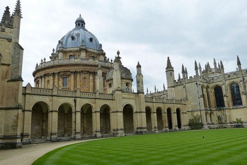 A historic building with a large dome and arched walkways. 2