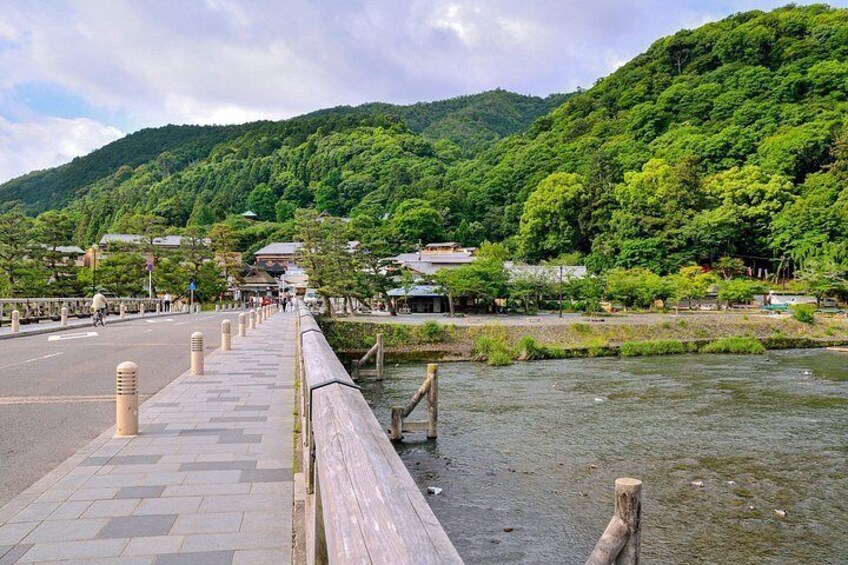 A bridge over a river with a mountain in the background. 4