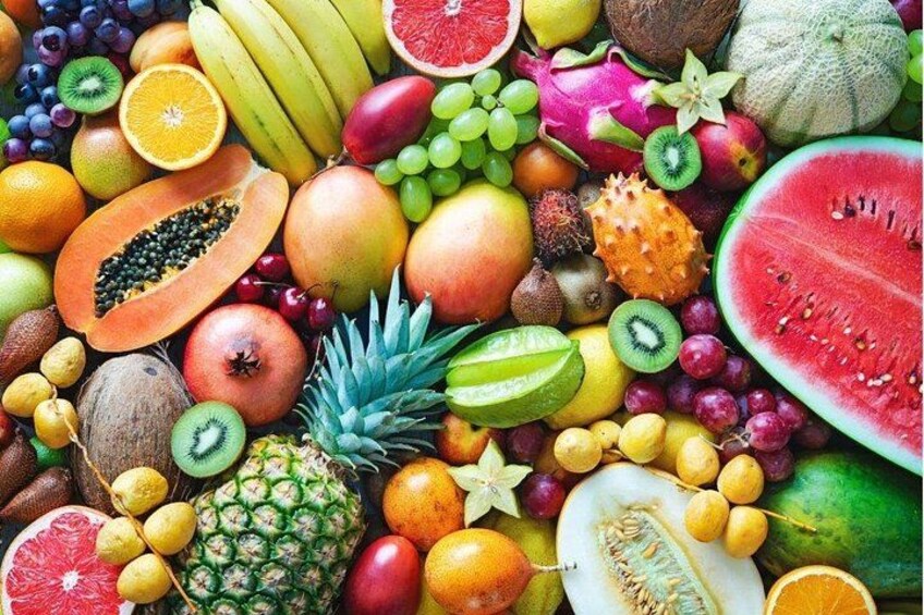 A variety of fruits including bananas, grapes, apples, and watermelon. 2