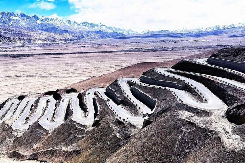 A mining operation with winding roads and large excavated areas. 2