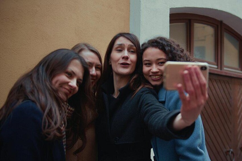 A group of people taking a selfie. 2