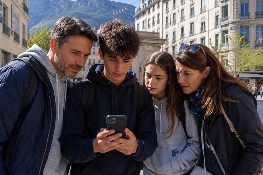 A group of people looking at a smartphone. 1