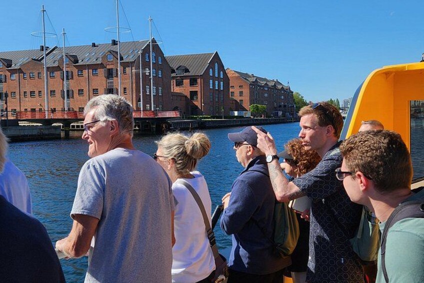 Guests enjoying the scenic harbor views on the electric ferry during our Walk & Ferry tour in Copenhagen. 4