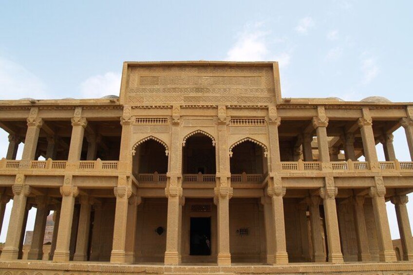 A large, ornate building with multiple arches and columns. 5