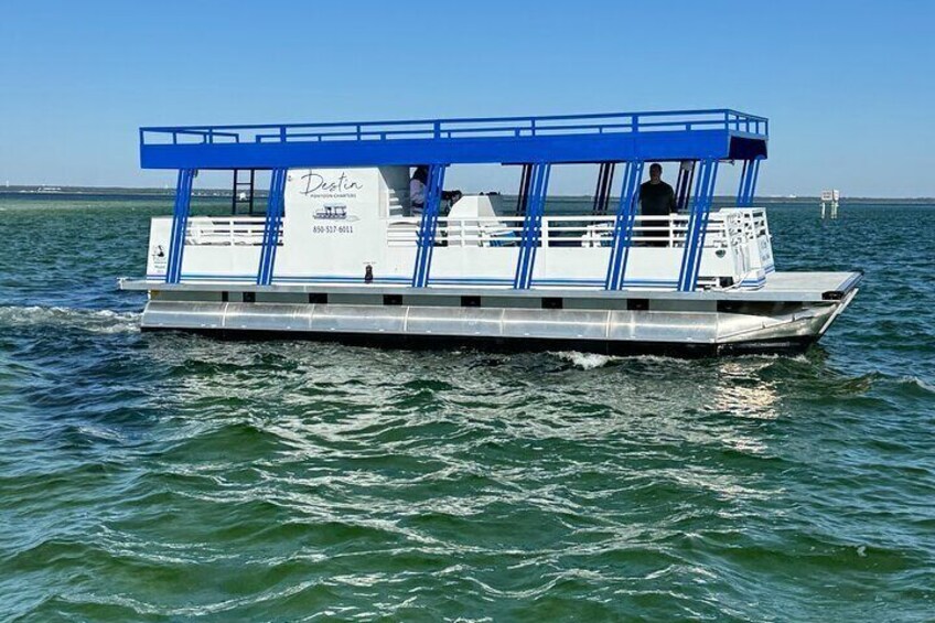 A blue and white boat named 'Dublin' on water. 1
